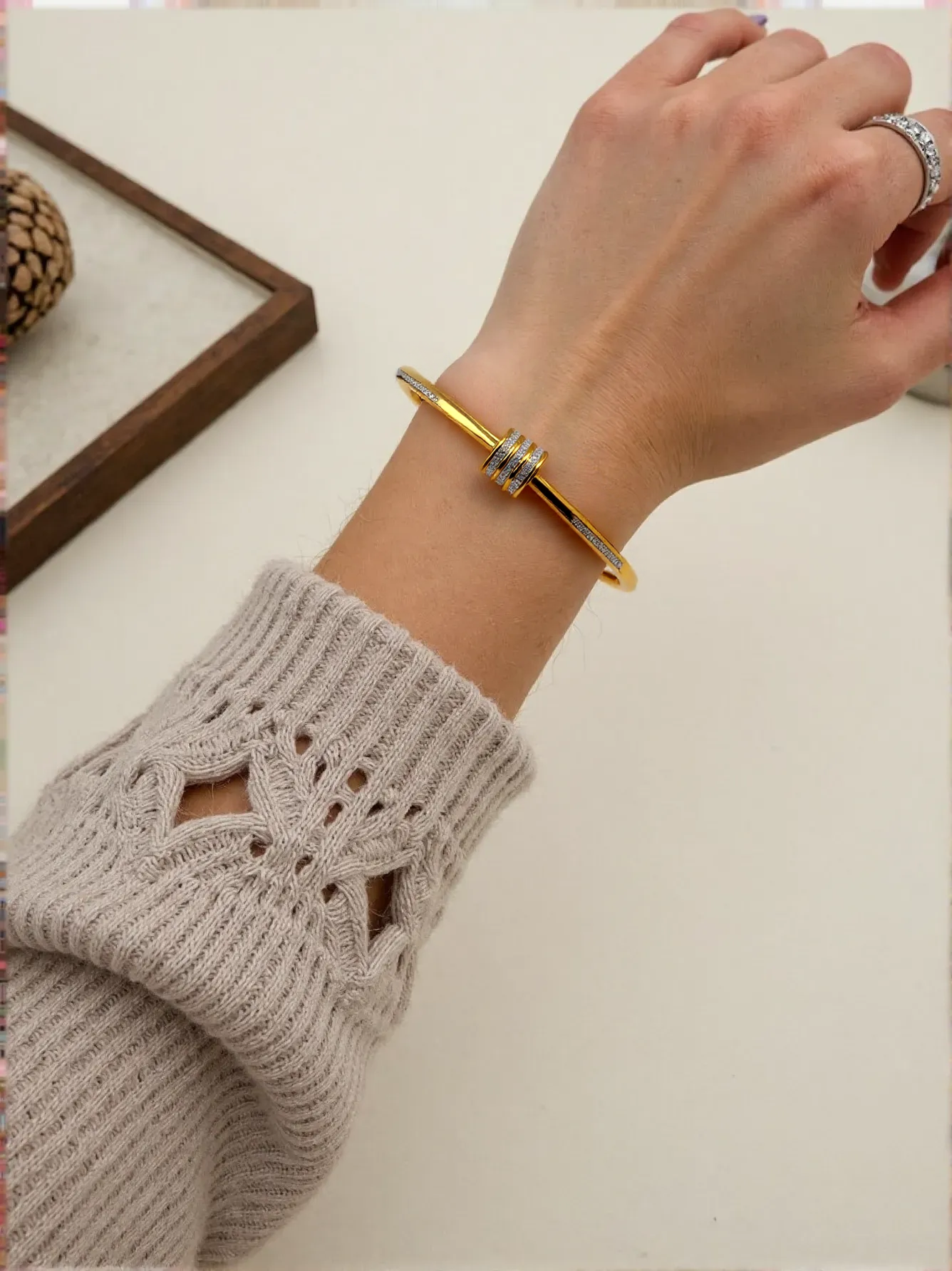 Gold-Tone Bangle with Crystal Charm